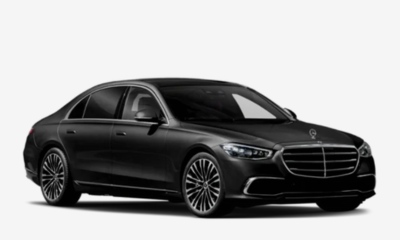 A black Mercedes-Benz sedan with a sophisticated design, highlighting its elegant grille and sleek profile.